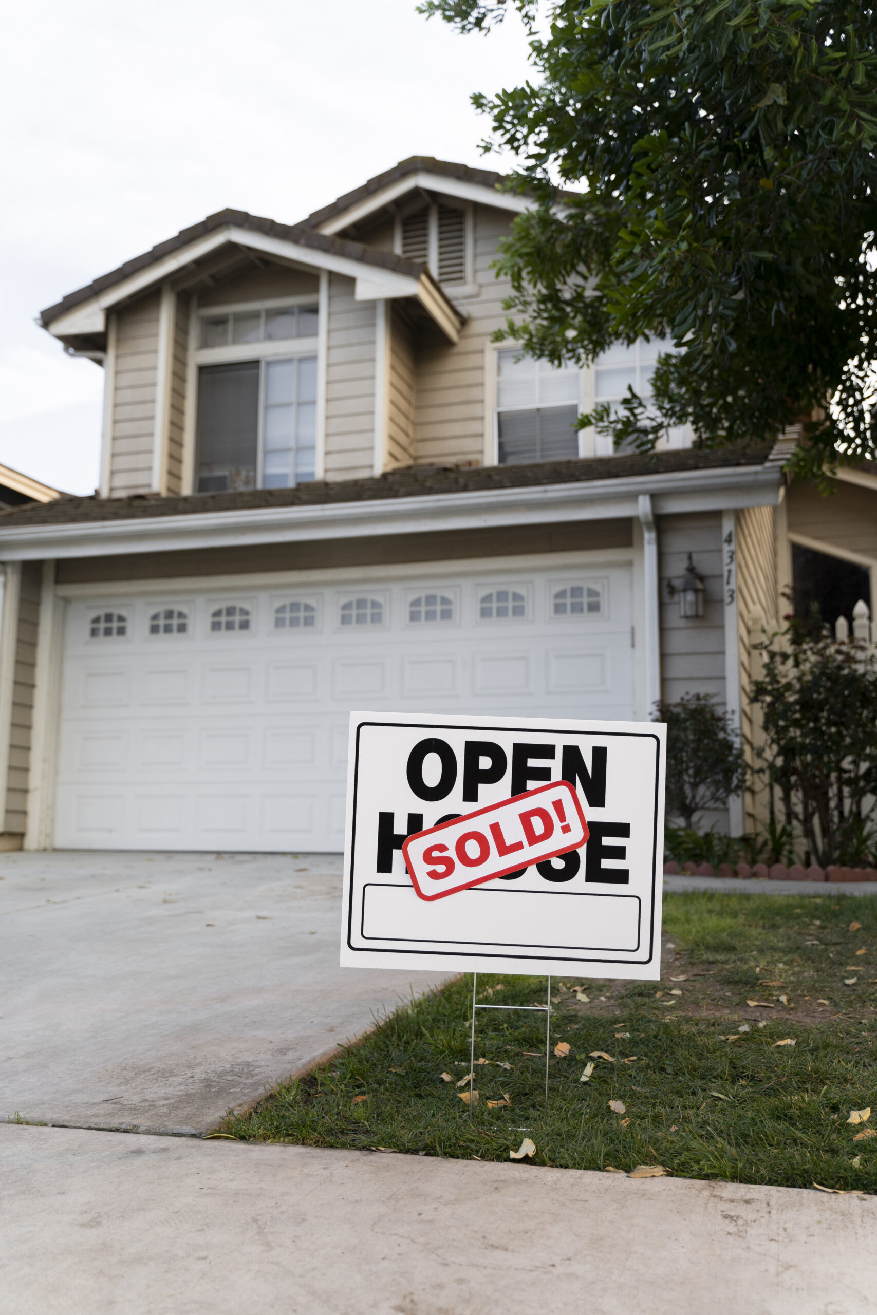 house-with-sold-yard-sign